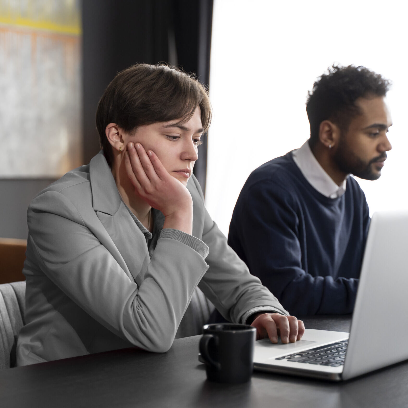 Home trans person working office with colleagues